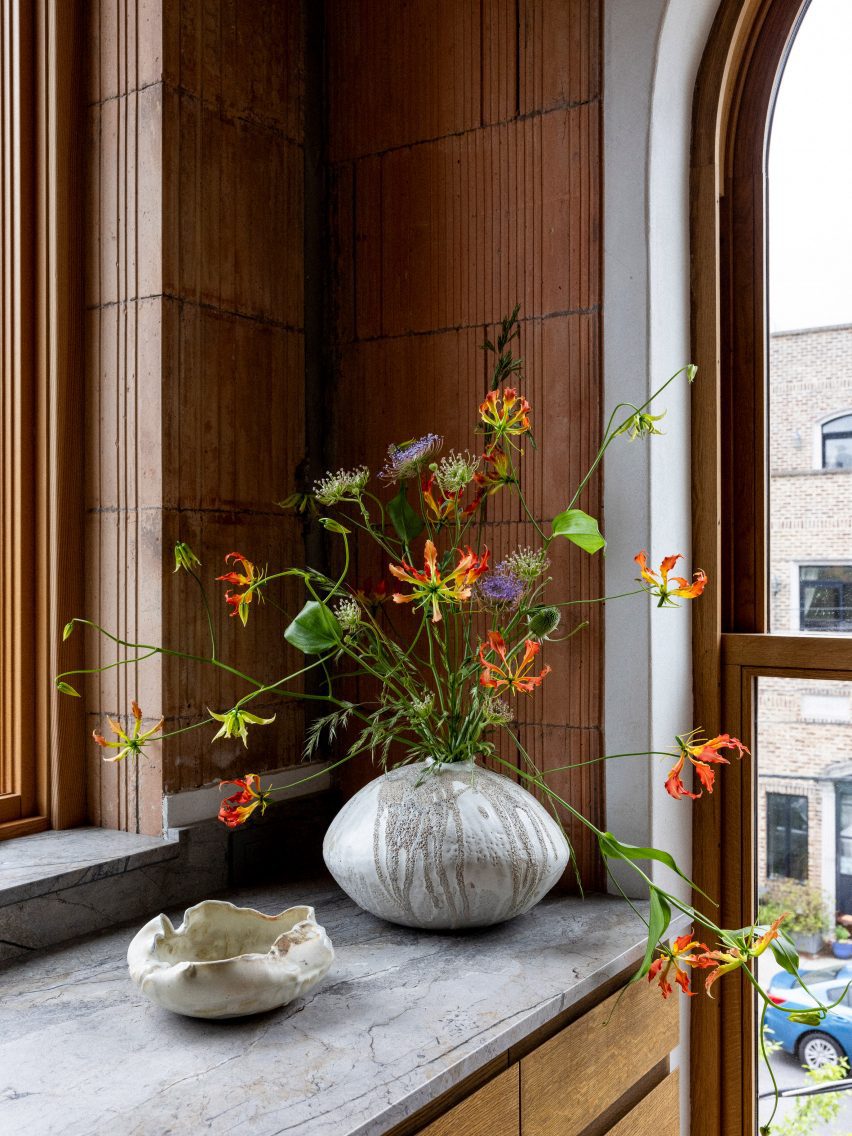 A table with a vase and flowers