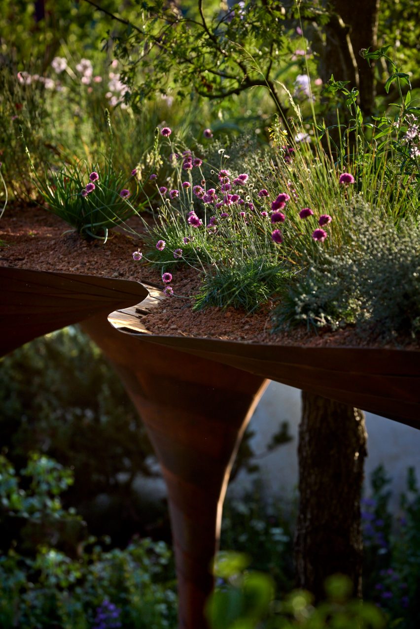 Flowers planted on roof of weathering-steel pavilion