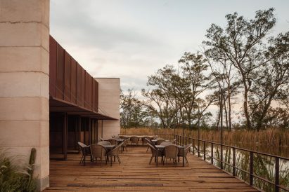 A deck with tables and chairs
