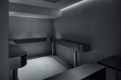 Small seating area with black benches and bars