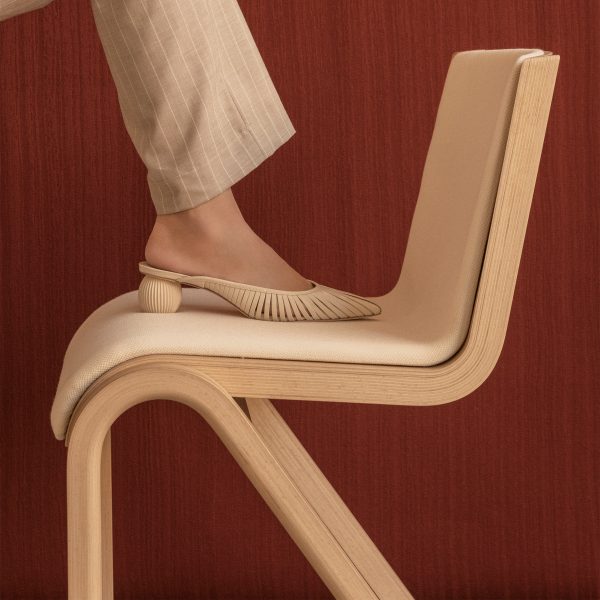 Photo of a foot on a chair by Audo Copenhagen