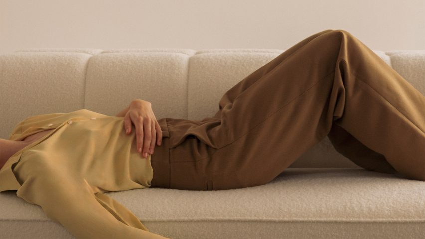Photo of person lying on a sofa by Audo Copenhagen