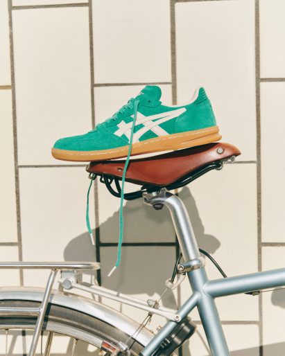 Green trainer on bike saddle