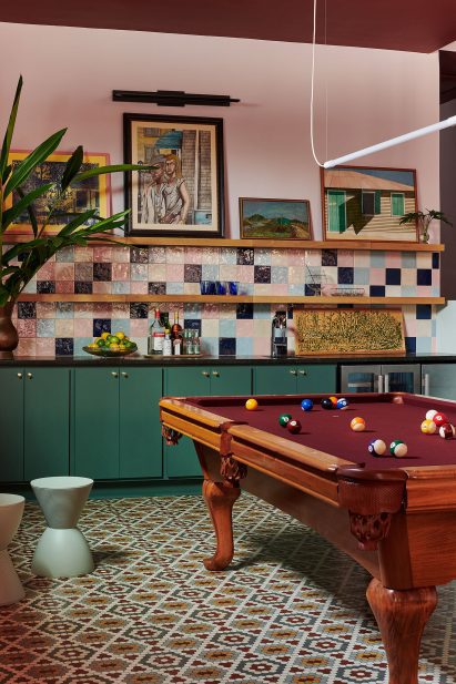 Colourful kitchen with billiard table in the middle