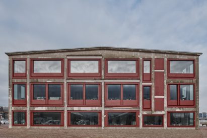 Concrete building with red-metal facade