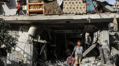 Children in a destroyed house in Rafah following an Israeli air strike in April 2024