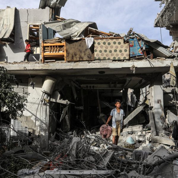 Children in a destroyed house in Rafah following an Israeli air strike in April 2024
