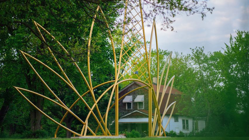 Sculpture next to house