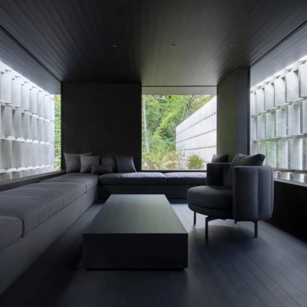 Angled concrete blocks screen home in Japanese forest by Nendo