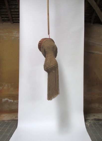 Photo of Christpher Kelly's Interwoven: Dis/Functional No.3 woven jute sculpture hanging in his studio
