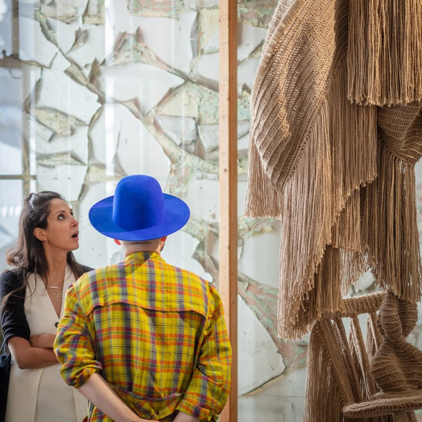 Close-up photo of audience members looking at jute sculptures by Christopher Kelly a the Future Icons Selects exhibition