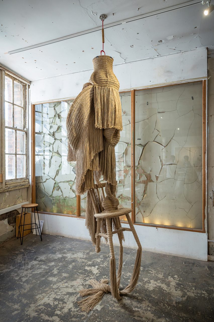 Photo of Christopher Kelly's Interwoven: Dis/functional No.1 textile sculpture hanging from a ceiling and dragging on the floor