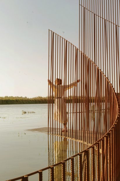 Person standing on Iron Reef installation