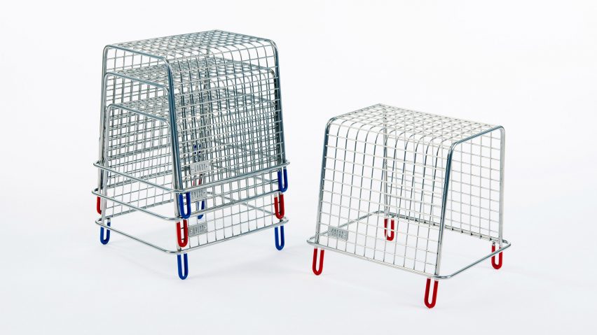 A photograph of silver metal stools with blue and red legs, three are stacked on top one another and one stands alone next to them.