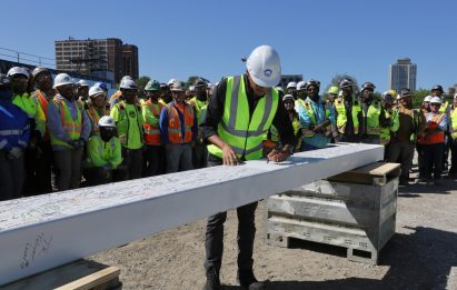 Obama signing a beam