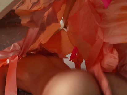 A photograph of a person draped in red fabric.