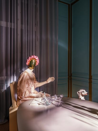 Female mannequin at a dining table