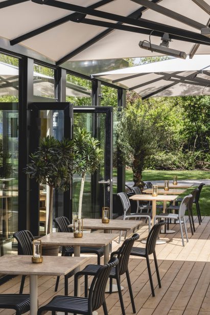Outdoor seating area at temporary restaurant by Jolie