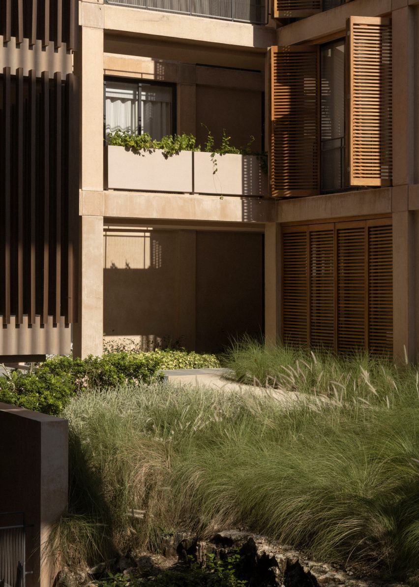 Bushes and around perimeter of courtyard
