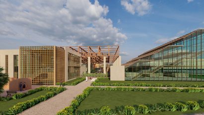 A visualisation of two buildings in tones of beige and one transparent. There is green grass in front of them and a blue sky above.
