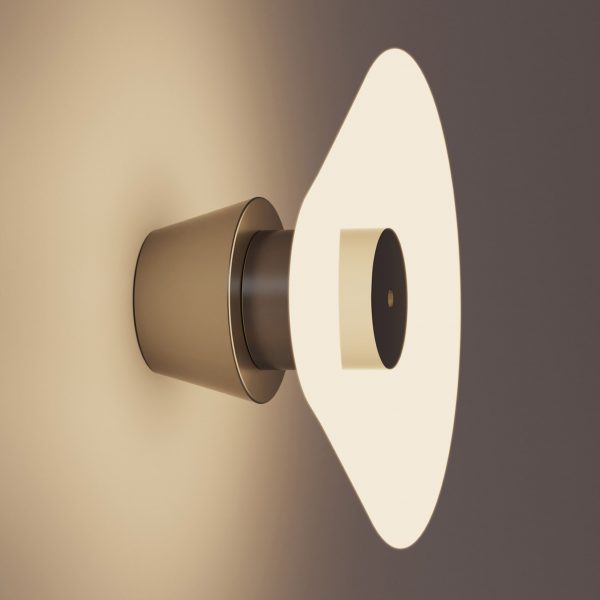 A photograph of a rounded illuminated light attached to a wall, in warm tones of beige and brown.