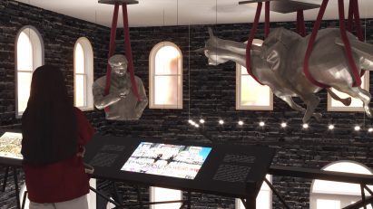 A visualisation of a museum space with black bricks on its walls. There are silver statues hanging from the ceiling in red rope, and a person viewing them.