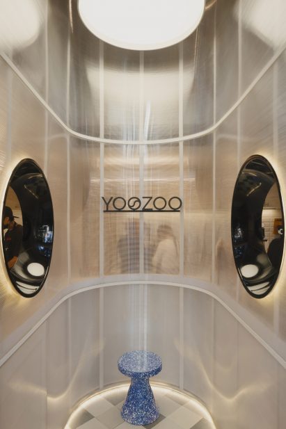 Vertical translucent tube with portholes on either side