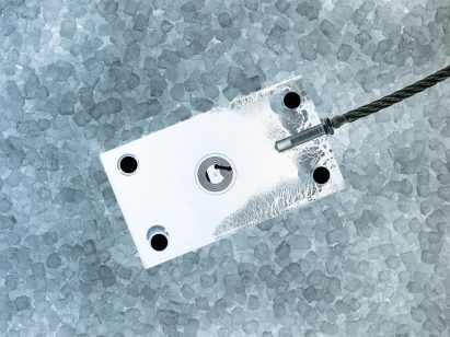 A visualisation of a white device against a textured blue and grey background.