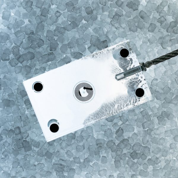 A visualisation of a white device against a textured blue and grey background.