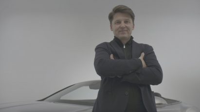 Markus Thiel in front of a car