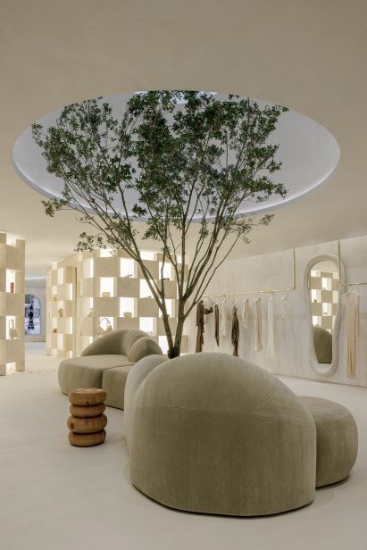 Sandstone blocks stacked around the fitting rooms and glow from behind