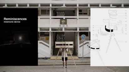 A photograph of a photographic device placed in front of a white building