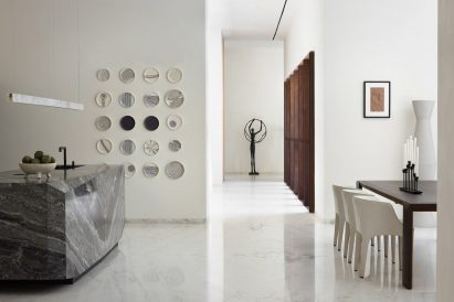 Kitchen and dining space within home by Studio VDGA