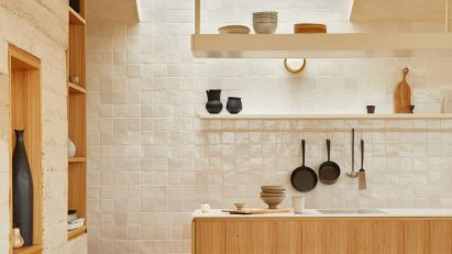 Tiled kitchen lit by skylight