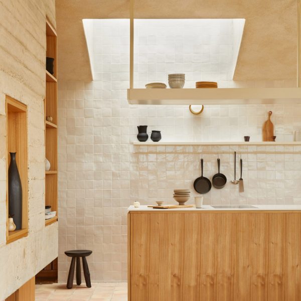 Tiled kitchen lit by skylight