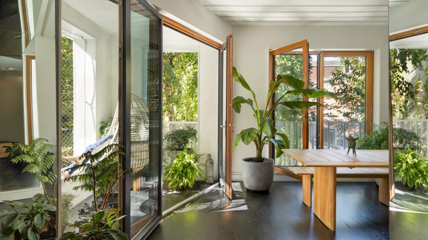A corner of a house with large windows