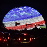 MSG Sphere Las Vegas at night showing a USA flag