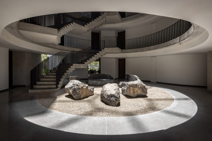Curved tower with rock garden