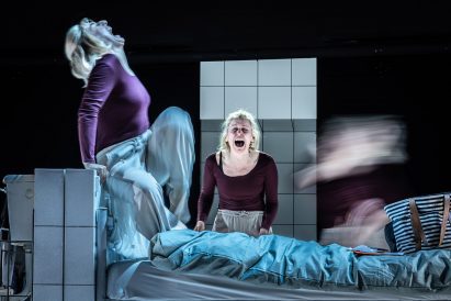 Actors emerging from the bed in People, Places and Things