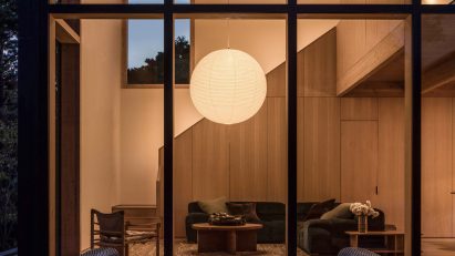 Circular paper lamp in a beach house living room