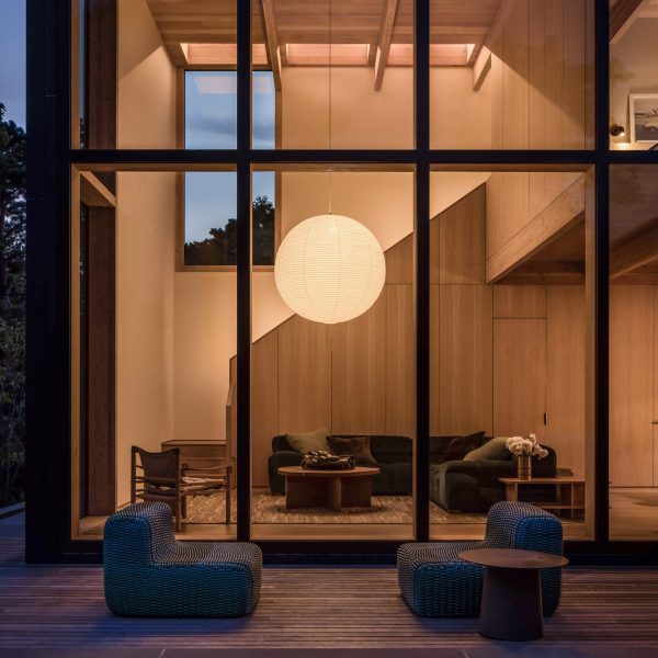 Circular paper lamp in a beach house living room