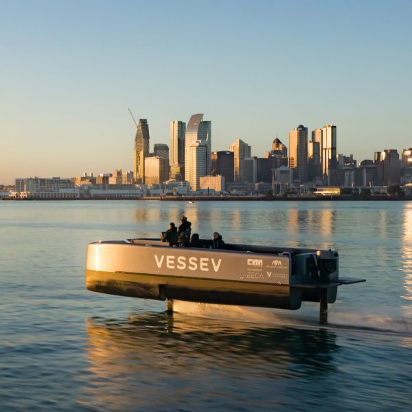 Vessev V-9 hydrofoil ferry captured via drone in front of the Auckland skyline