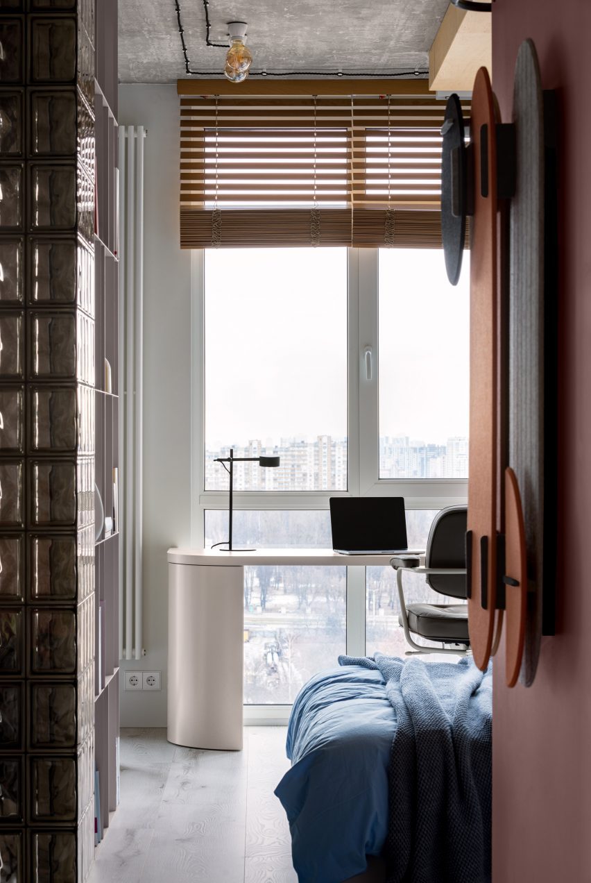 Hallway leading to bedroom and desk looking over Kyiv