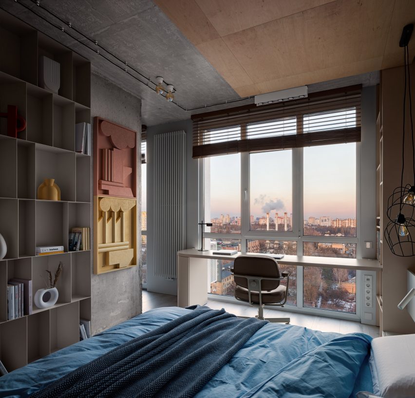 Concrete pillar with inbuilt shelving dividing bedroom from apartment