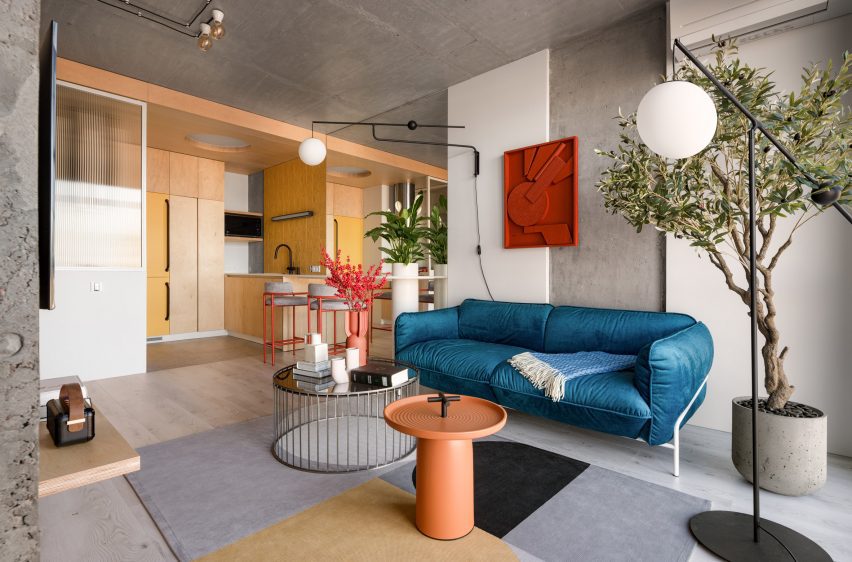Open plan living space and kitchen in Suprematism apartment
