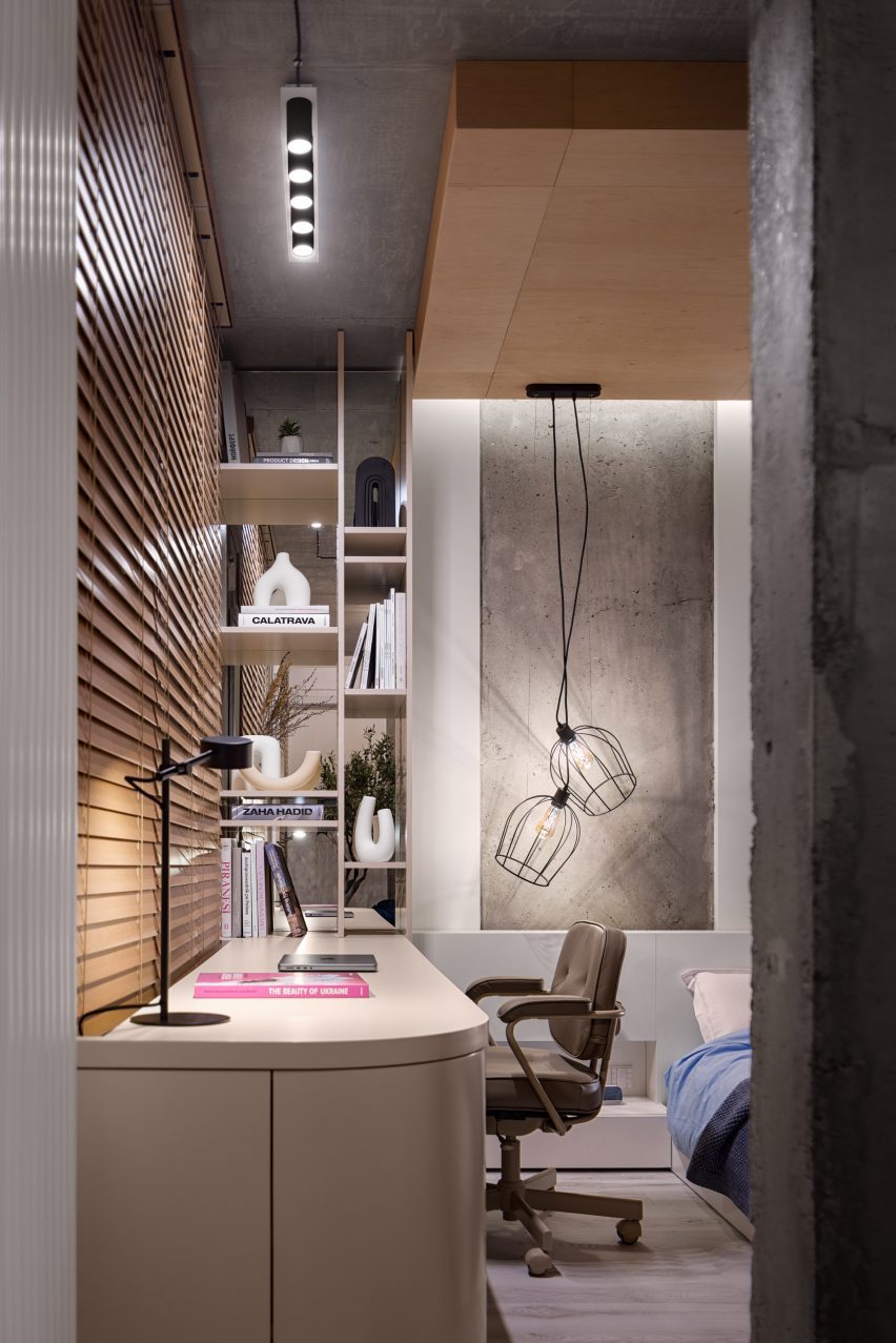 Desk and concrete wall in Dihome designed flat Ukraine