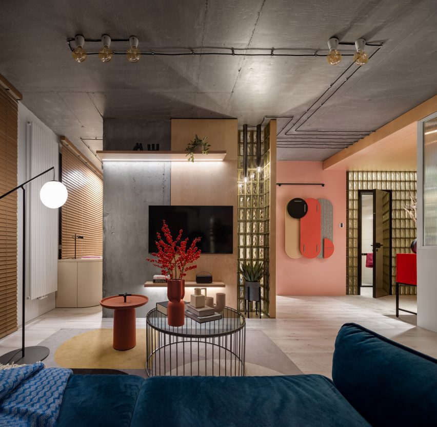 Sofa looking out over open plan living space with concrete pillar