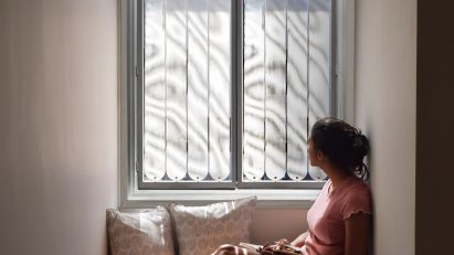 Woman sitting in front of TransSense Screens