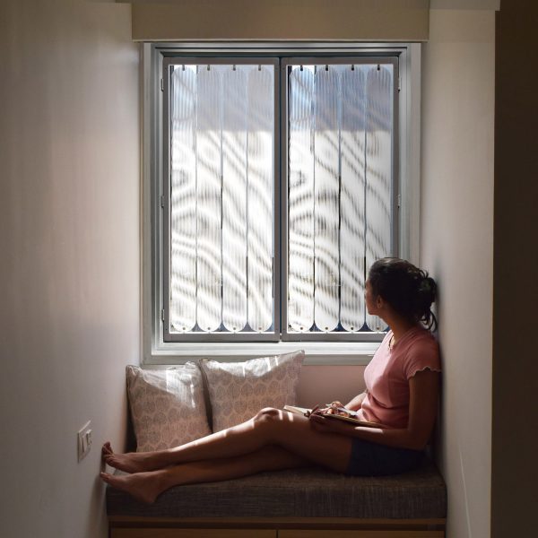 Woman sitting in front of TransSense Screens