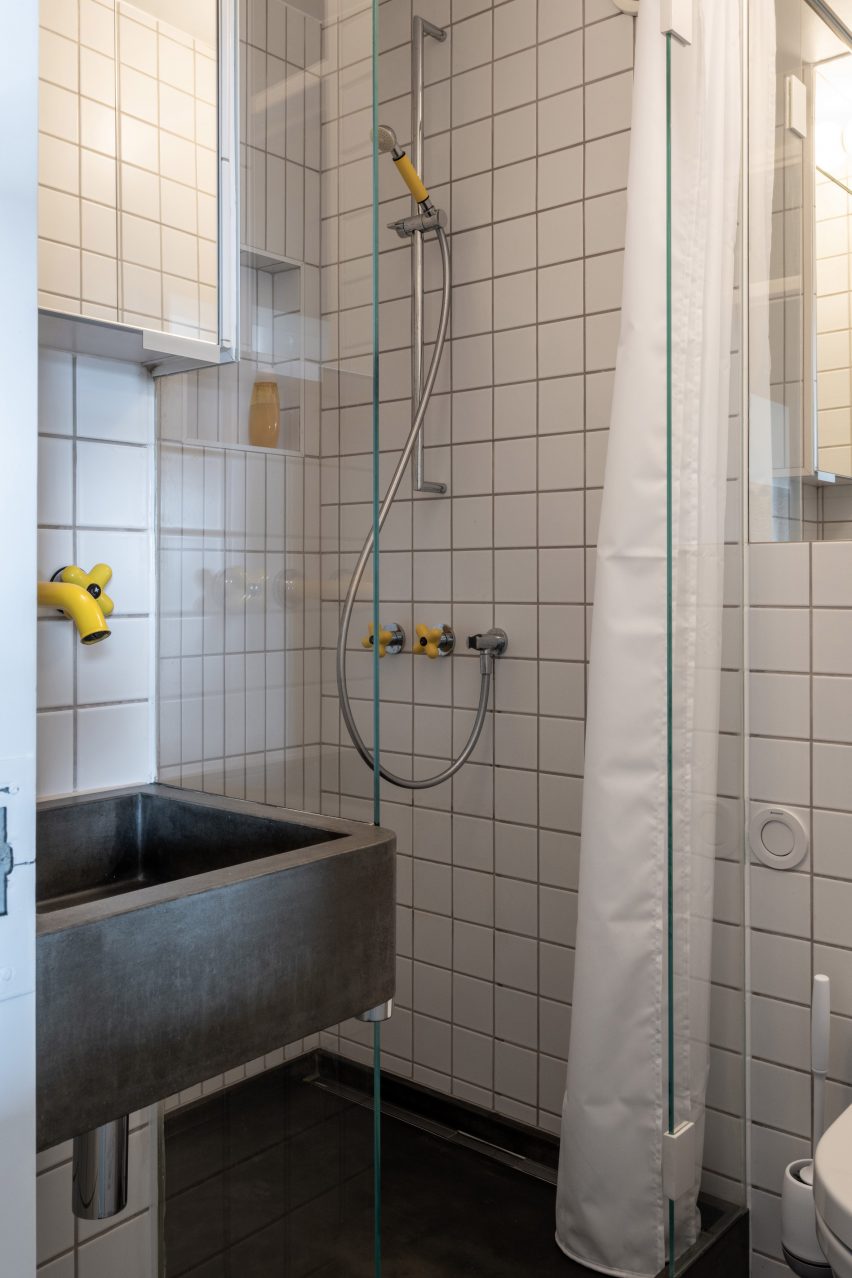 Bathroom with yellow taps in Trellick apartment by Archmongers